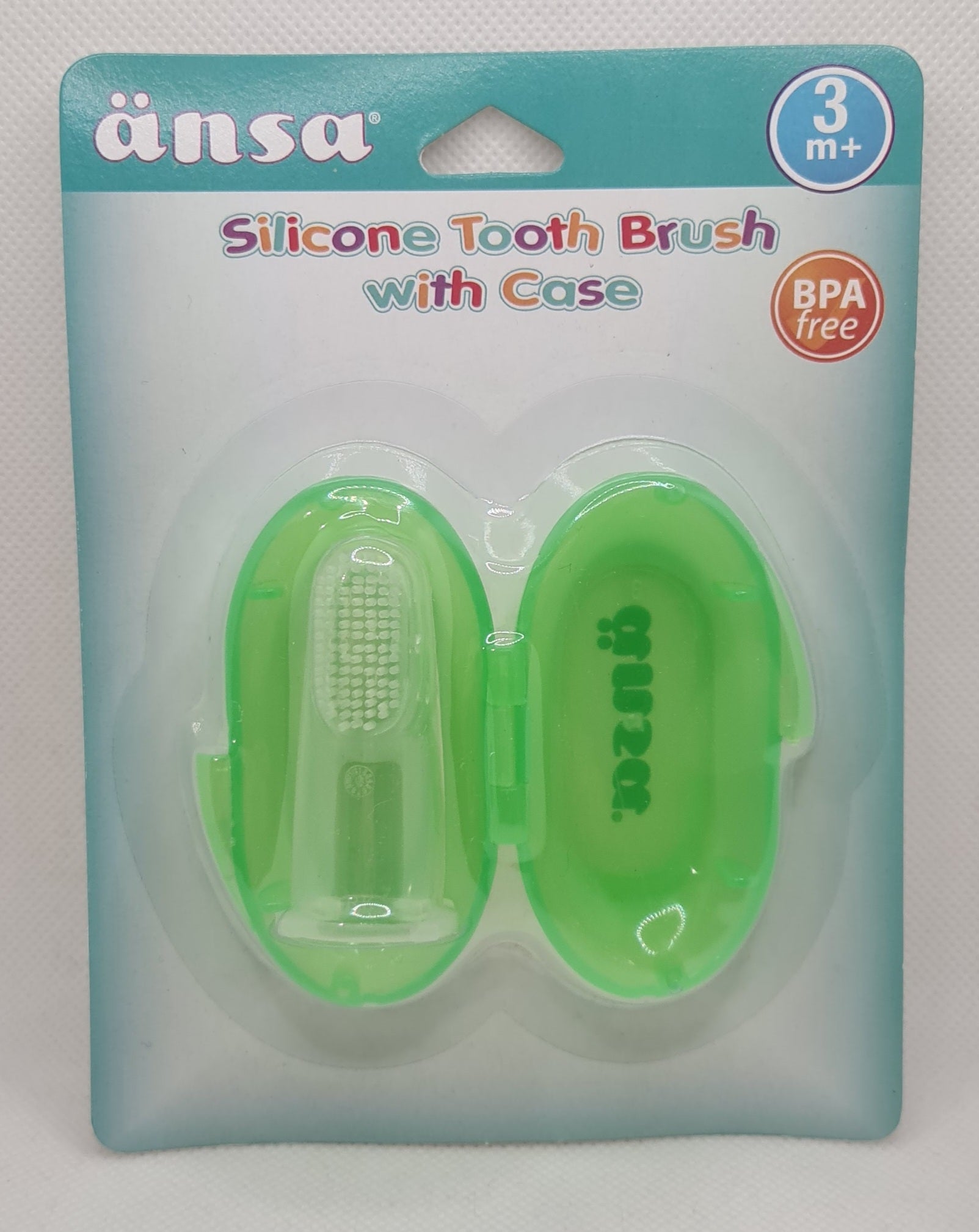 a green toothbrush in a package