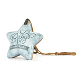 a blue star shaped christmas ornament with a tassel